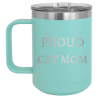 Laser etched teal 15 oz vacuum insulated coffee mug with 'Proud Cat Mom' design