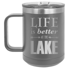 Laser etched dark gray 15 oz vacuum insulated coffee mug with 'Life is Better at the Lake' design