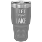 Laser etched dark gray 30 oz vacuum insulated tumbler with 'Life is Better at the Lake' design