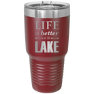 Laser etched maroon 30 oz vacuum insulated tumbler with 'Life is Better at the Lake' design