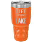 Laser etched orange 30 oz vacuum insulated tumbler with 'Life is Better at the Lake' design