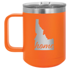 Laser etched orange 15 oz vacuum insulated coffee mug with 'Idaho Home' design