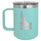 Laser etched teal 15 oz vacuum insulated coffee mug with 'Idaho Home' design