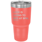 Laser etched coral 30 oz vacuum insulated tumbler with 'Love is Going to Bed at 9pm' design