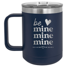 Laser etched navy 15 oz vacuum insulated coffee mug with 'Be Mine Mine Mine' design