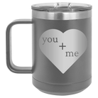 Laser etched dark gray 15 oz vacuum insulated coffee mug with 'You Plus Me' design