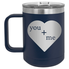 Laser etched navy 15 oz vacuum insulated coffee mug with 'You Plus Me' design