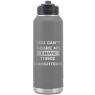 Laser etched dark gray 32 oz vacuum insulated water bottle with 'You Cant Scare Me' design