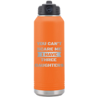 Laser etched orange 32 oz vacuum insulated water bottle with 'You Cant Scare Me' design