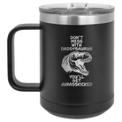 Personalized black 15 oz vacuum insulated coffee mug with etched 'Daddysaurus' design