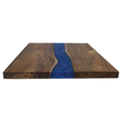 Edge of acacia serving board with pearl resin