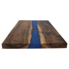Edge of acacia serving board with pearl resin