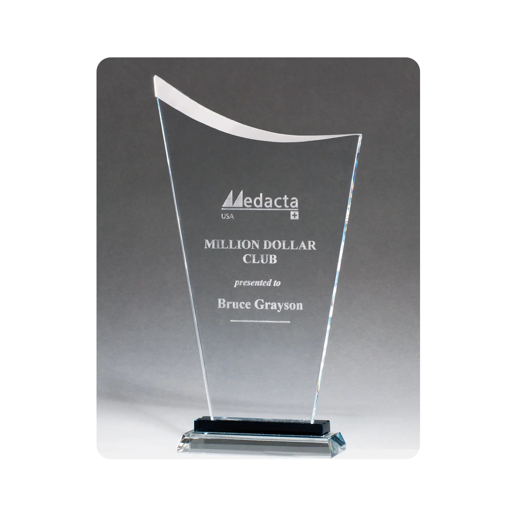 Contemporary clear glass award with pedestal base, custom etched for your milestone, event, or recognition. 