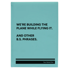 Large teal leatherette journal laser etched with 'We're Building The Plane While Flying It. And Other B.S. Phrases' design