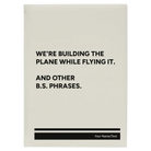 Large white leatherette sketch book laser etched with 'We're Building The Plane While Flying It. And Other B.S. Phrases' design