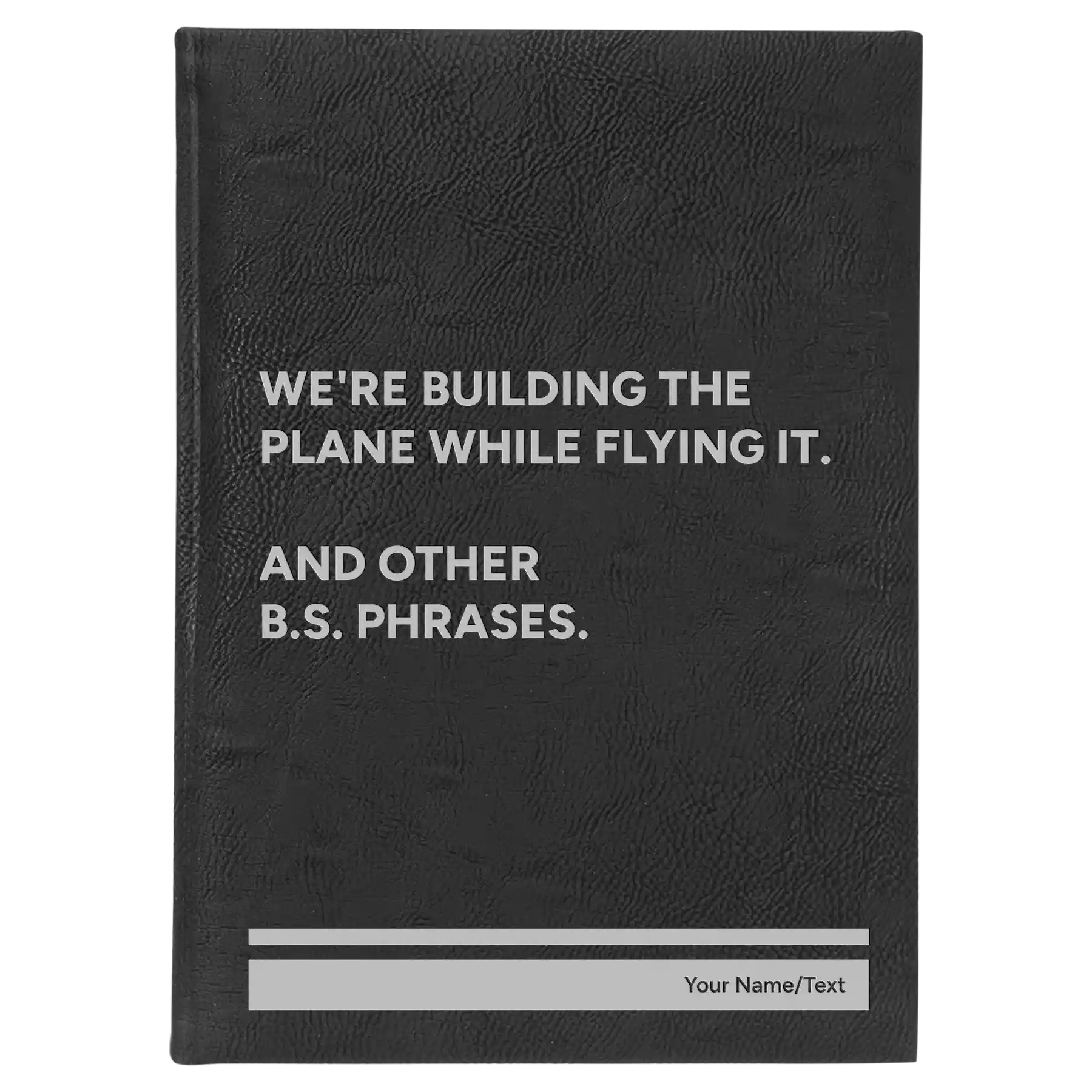 Large black/silver leatherette journal laser etched with 'We're Building The Plane While Flying It. And Other B.S. Phrases' design