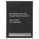 Large black/silver leatherette sketch book laser etched with 'We're Building The Plane While Flying It. And Other B.S. Phrases' design