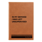 Small rawhide leatherette sketch book laser etched with 'Left Unsupervised' design