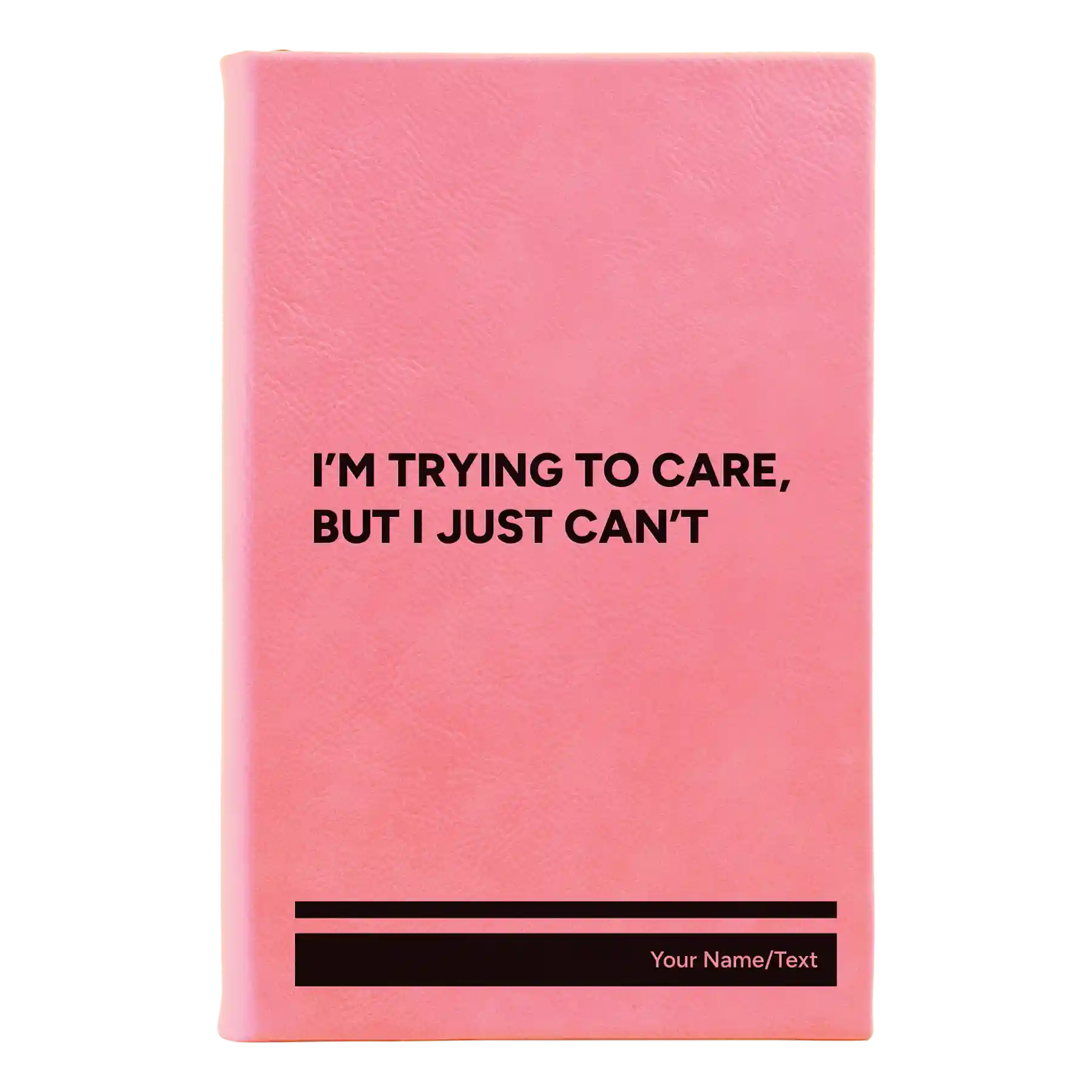 Small pink leatherette sketch book laser etched with 'Trying to Care' design