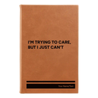 Small rawhide leatherette sketch book laser etched with 'Trying to Care' design