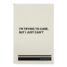 Small white leatherette journal laser etched with 'Trying to Care' design