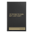 Small black/gold leatherette journal laser etched with 'Trying to Care' design