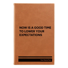 Small rawhide leatherette journal laser etched with 'Lower Your Expectations' design