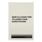 Small white leatherette journal laser etched with 'Lower Your Expectations' design