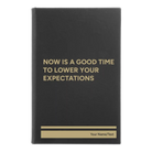 Small black/gold leatherette sketch book laser etched with 'Lower Your Expectations' design