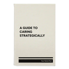 Small white leatherette journal laser etched with 'A guide to caring strategically' design