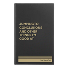 Small black/gold leatherette journal laser etched with 'Jumping to conclusions and other things Im good at' design
