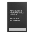 Small black/silver leatherette journal laser etched with 'We're Building The Plane While Flying It. And Other B.S. Phrases' design