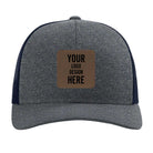 Custom navy heather navy Richardson 115CH Low Pro Trucker Hat with laser etched square leatherette patch