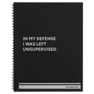 Large black spiral notebook laser etched with 'Left Unsupervised' design