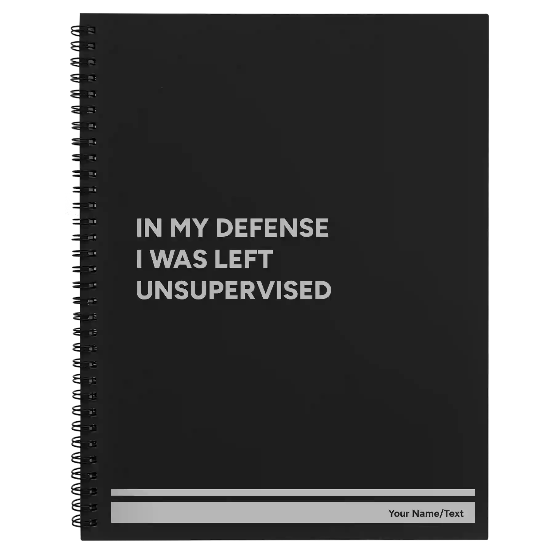 Large black spiral notebook laser etched with 'Left Unsupervised' design