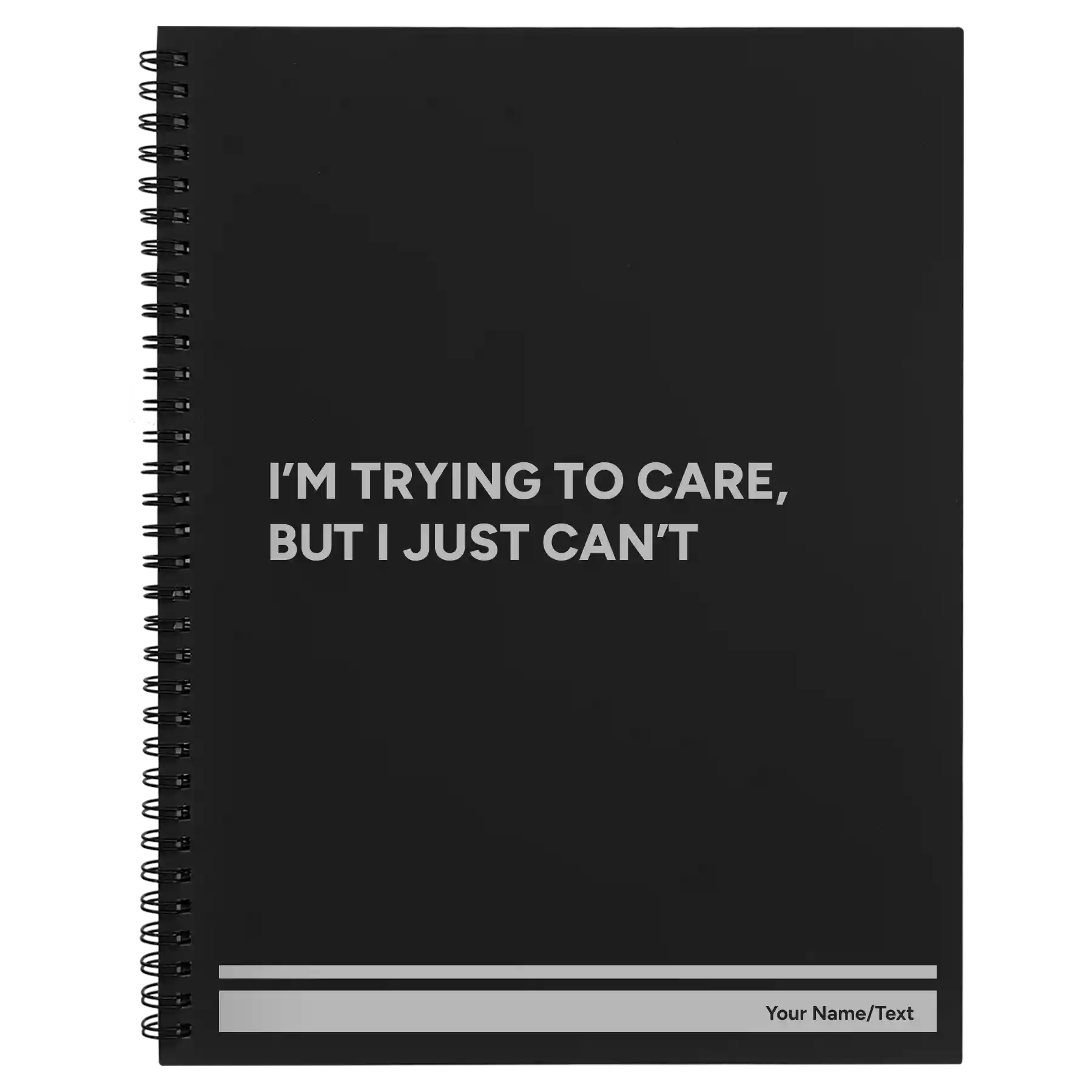 Large black spiral notebook laser etched with 'Trying to Care' design