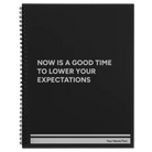 Large black spiral notebook laser etched with 'Lower Your Expectations' design