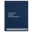 Large blue spiral notebook laser etched with 'A guide to caring strategically' design