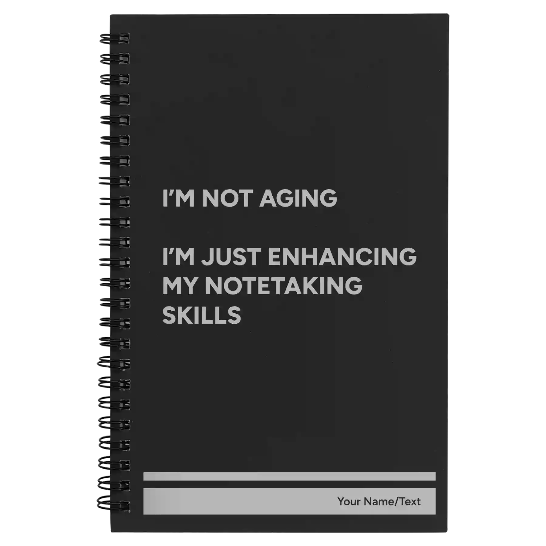Small black spiral notebook laser etched with 'Not Aging' design