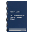 Small blue spiral notebook laser etched with 'Not Aging' design