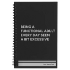 Small black spiral notebook laser etched with 'Functional Adult' design