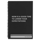 Small black spiral notebook laser etched with 'Lower Your Expectations' design