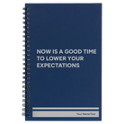 Small blue spiral notebook laser etched with 'Lower Your Expectations' design