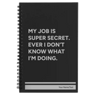 Small black spiral notebook laser etched with 'My Job is Super Secret' design