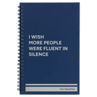 Small blue spiral notebook laser etched with 'Fluent in Silence' design