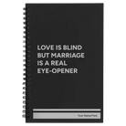 Small black spiral notebook laser etched with 'Love is Blind' design