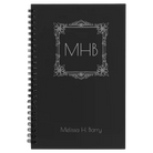 Small black spiral notebook laser etched with 'Floral Frame' design