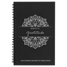 Small black spiral notebook laser etched with 'Moments of Gratitude' design