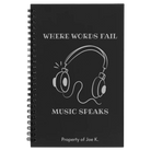 Small black spiral notebook laser etched with 'Music Speaks' design