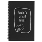 Small black spiral notebook laser etched with 'Bright Ideas Journal' design